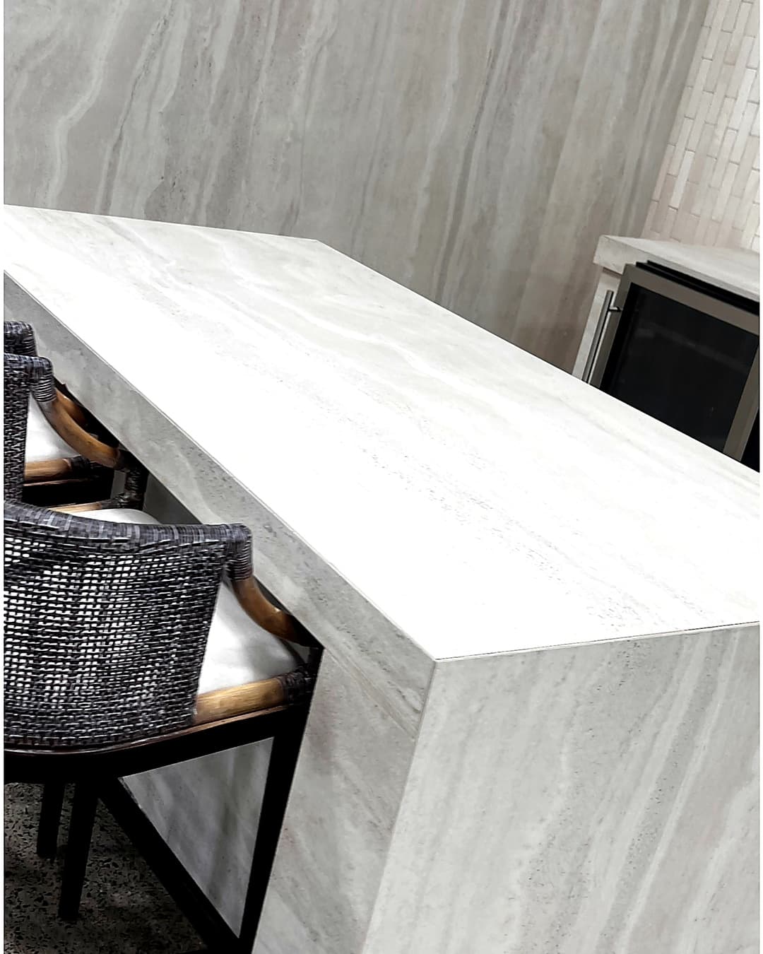 Kitchen bar with stone waterfall countertop